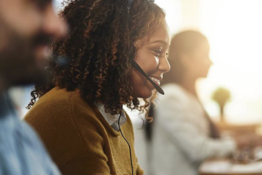 A call center agent successfully assists a customer who speaks Spanish after dialing an interpreter.